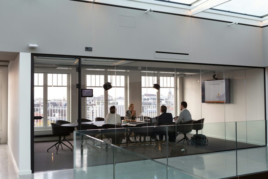 Distant view of a conference room during a consultation meeting.